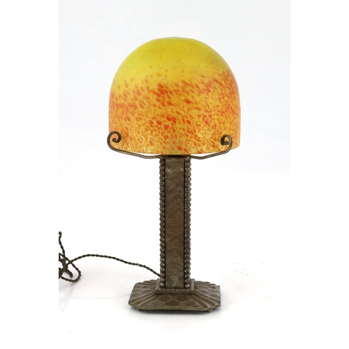 41 - Mulaty, a Continental Arts & Craft wrought iron and marbled glass table lamp, in the manner of Edgar... 