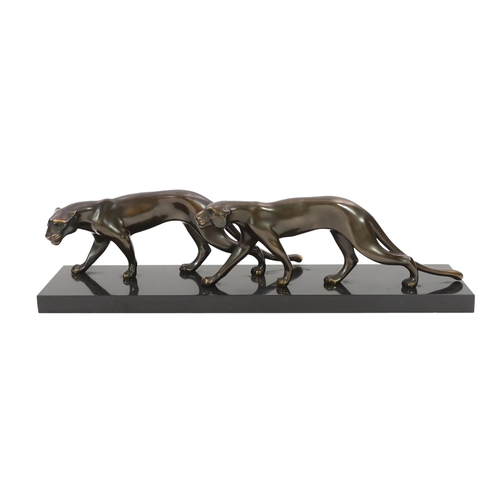 42 - Marty Font, a French Art Deco bronzed and black marble group of two prowling panthers, signed on the... 