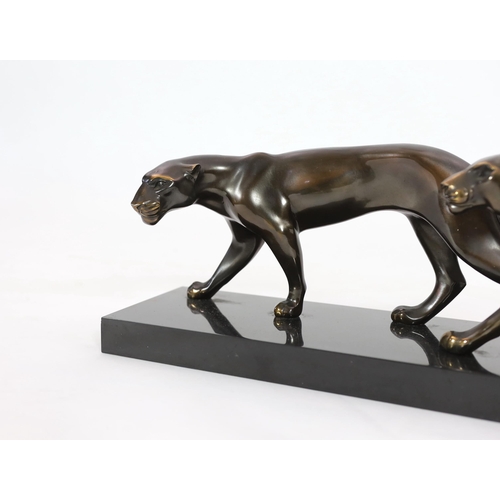 42 - Marty Font, a French Art Deco bronzed and black marble group of two prowling panthers, signed on the... 