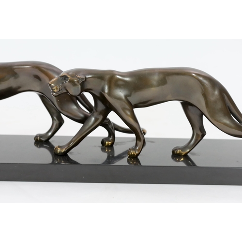 42 - Marty Font, a French Art Deco bronzed and black marble group of two prowling panthers, signed on the... 