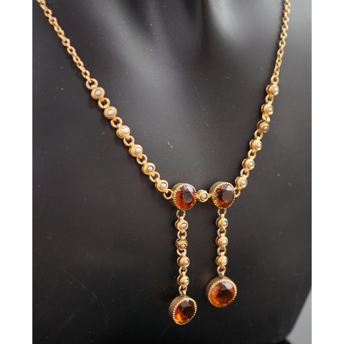 452 - An Edwardian 15ct gold, seed pearl and citrine graduated double drop necklace, set with four round c... 