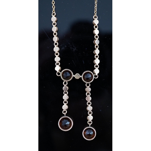 452 - An Edwardian 15ct gold, seed pearl and citrine graduated double drop necklace, set with four round c... 