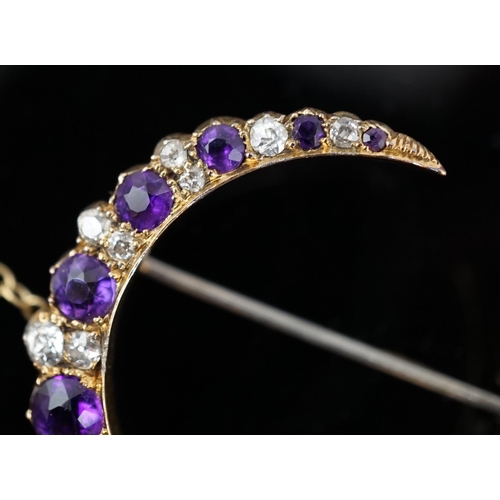 453 - A late Victorian gold, graduated amethyst and diamond cluster set crescent brooch, 33mm, with safety... 