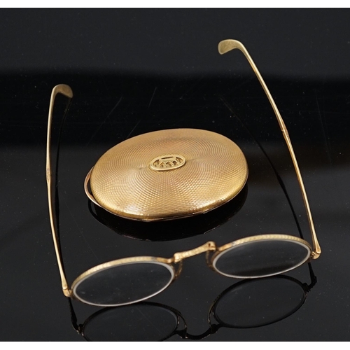 456 - A pair of engraved gold mounted spectacles, with double hinged arms, unmarked, arm length 11.1cm, wi... 