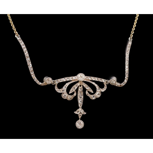 457 - A Belle Epoque gold and silver, round and rose cut diamond cluster set pendant necklace, of scrollin... 