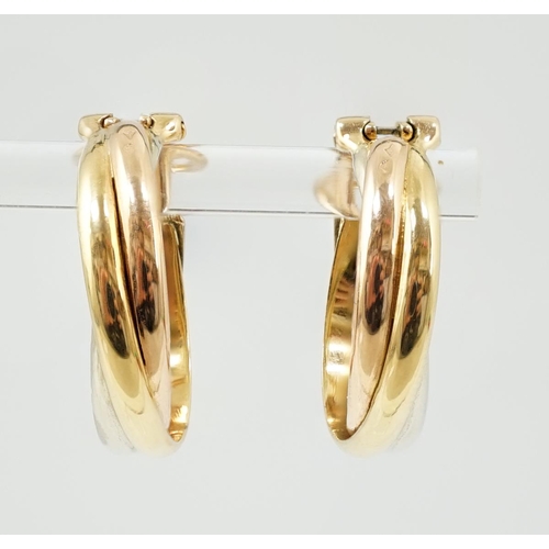 505 - A pair of French Cartier three colour 18ct gold interwoven hoop ear clips, signed and numbered 03074... 