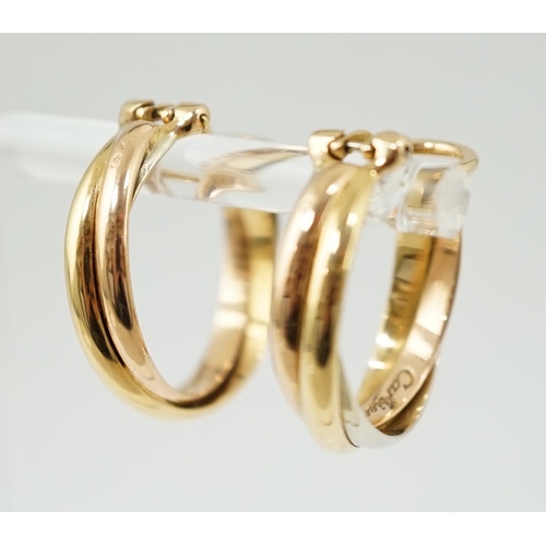 505 - A pair of French Cartier three colour 18ct gold interwoven hoop ear clips, signed and numbered 03074... 