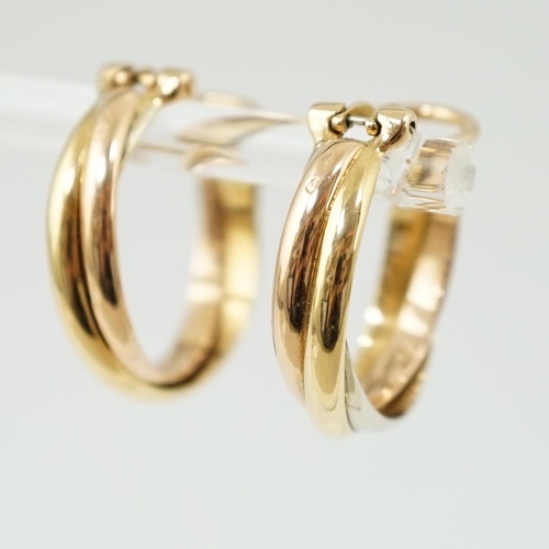 505 - A pair of French Cartier three colour 18ct gold interwoven hoop ear clips, signed and numbered 03074... 