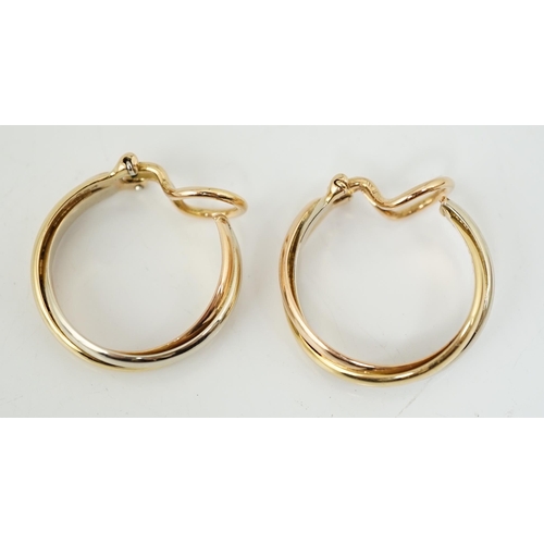 505 - A pair of French Cartier three colour 18ct gold interwoven hoop ear clips, signed and numbered 03074... 