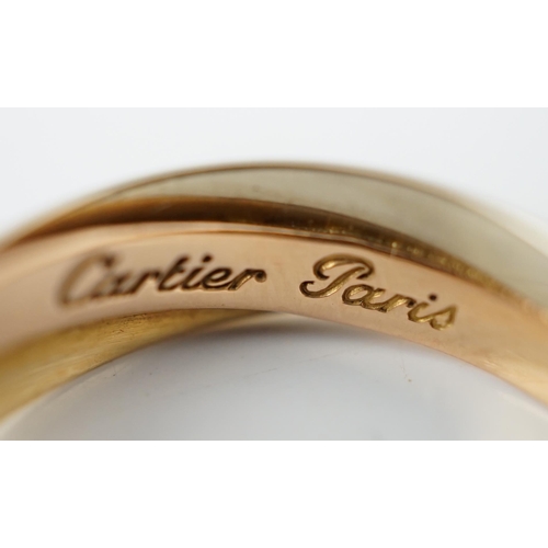 505 - A pair of French Cartier three colour 18ct gold interwoven hoop ear clips, signed and numbered 03074... 