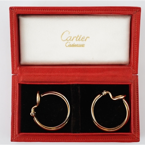 505 - A pair of French Cartier three colour 18ct gold interwoven hoop ear clips, signed and numbered 03074... 