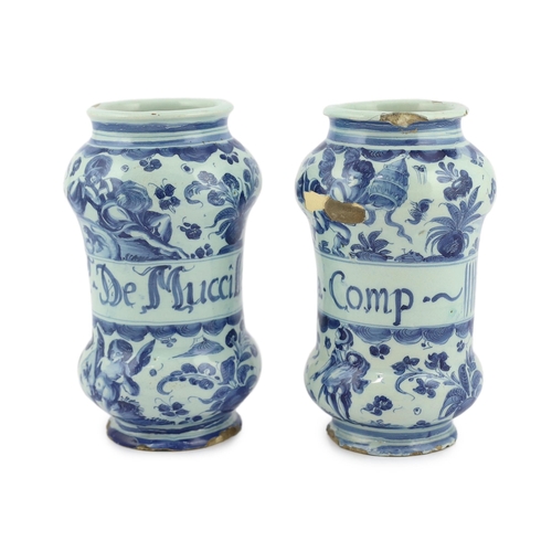 58 - A pair of Italian blue and white maiolica albarellos, Savona, late 17th century, the first painted w... 