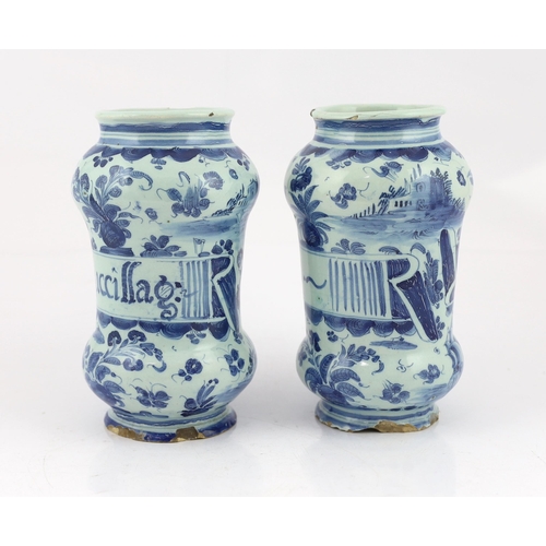 58 - A pair of Italian blue and white maiolica albarellos, Savona, late 17th century, the first painted w... 