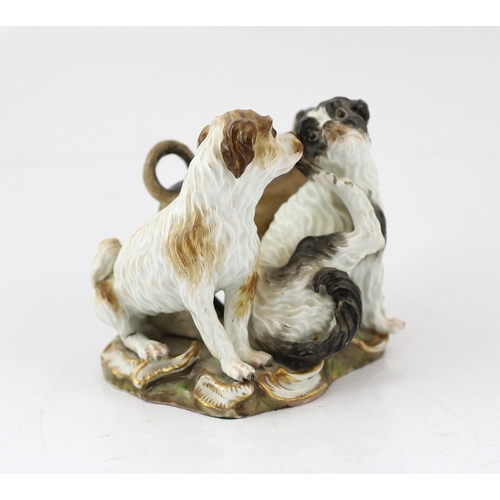 61 - A Meissen group of two terriers and a pug-dog, modelled by Kandler, 19th century, the dogs standing ... 