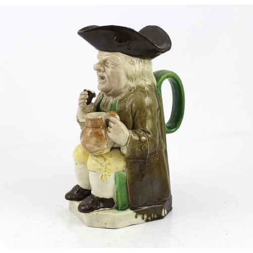 65 - A Ralph Wood type creamware Toby jug of standard type, raising a glass to his lips, c.1790, decorate... 