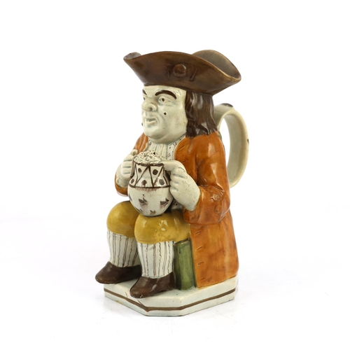 67 - A Staffordshire Prattware Toby jug, c.1790-1800, seated in standard pose holding a frothing beer mug... 