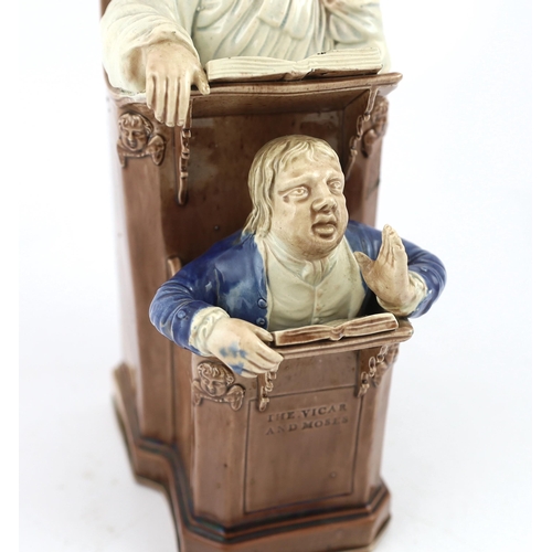 68 - A Ralph Wood type creamware Vicar and Moses group, c.1790, the two figures modelled standing in a pu... 