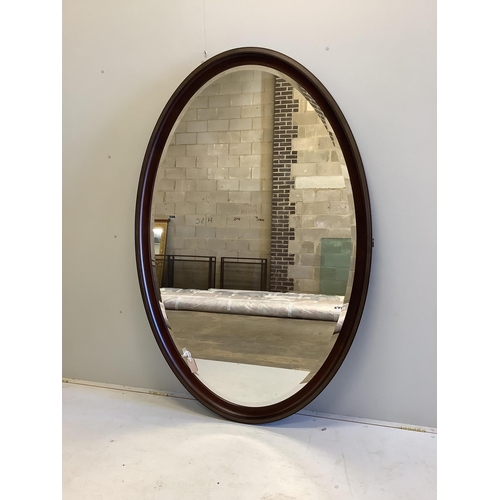 2001 - A large bespoke oval brass mounted mahogany mirror by Archer and Smith, width 118cm, height 179cm an... 