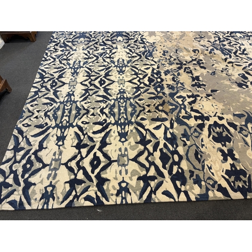 2062 - An Elizabeth Ashard 'Moghul', a silk and wool blue tones pattern carpet, 665 x 440cm