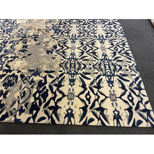 2062 - An Elizabeth Ashard 'Moghul', a silk and wool blue tones pattern carpet, 665 x 440cm