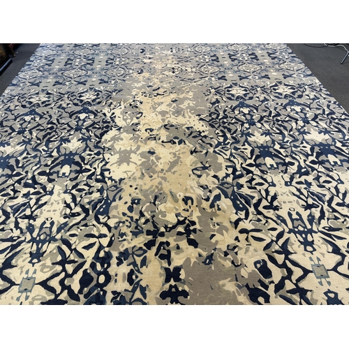 2062 - An Elizabeth Ashard 'Moghul', a silk and wool blue tones pattern carpet, 665 x 440cm