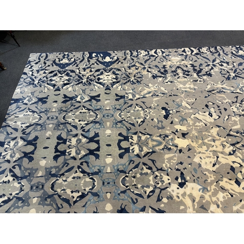 2062 - An Elizabeth Ashard 'Moghul', a silk and wool blue tones pattern carpet, 665 x 440cm