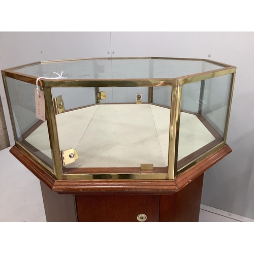 2079 - A pair of octagonal brass mounted display cases, width 69cm, height 90cm