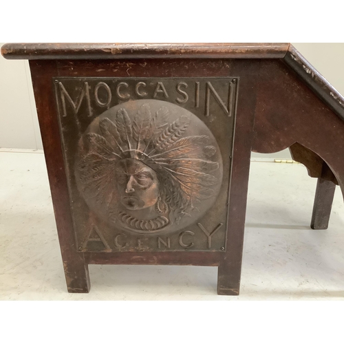 2108 - An early 20th century American Moccasin Agency embossed metal mounted shoe shine seat, width 64cm, d... 