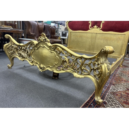 2117 - A rococo style giltwood and composition double bedframe from the collection of Raine, Countess Spenc... 