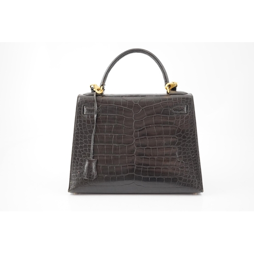 2269 - A vintage Hermès 28 Kelly in black alligator with gilt metalware, the bag has a square symbol near t... 