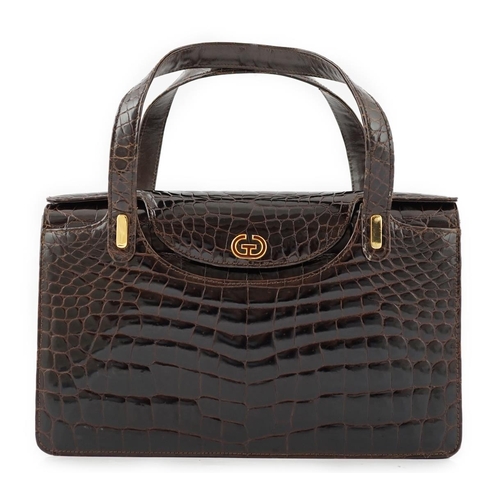 2295 - A lady's vintage brown crocodile handbag with gilt metalware.Please note that this American Alligato... 