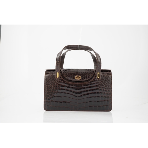 2295 - A lady's vintage brown crocodile handbag with gilt metalware.Please note that this American Alligato... 