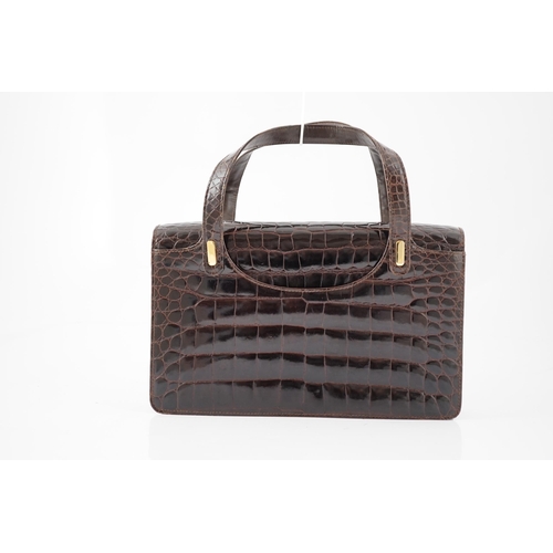 2295 - A lady's vintage brown crocodile handbag with gilt metalware.Please note that this American Alligato... 