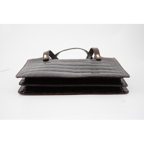 2295 - A lady's vintage brown crocodile handbag with gilt metalware.Please note that this American Alligato... 