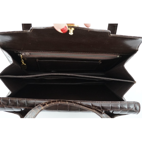 2295 - A lady's vintage brown crocodile handbag with gilt metalware.Please note that this American Alligato... 