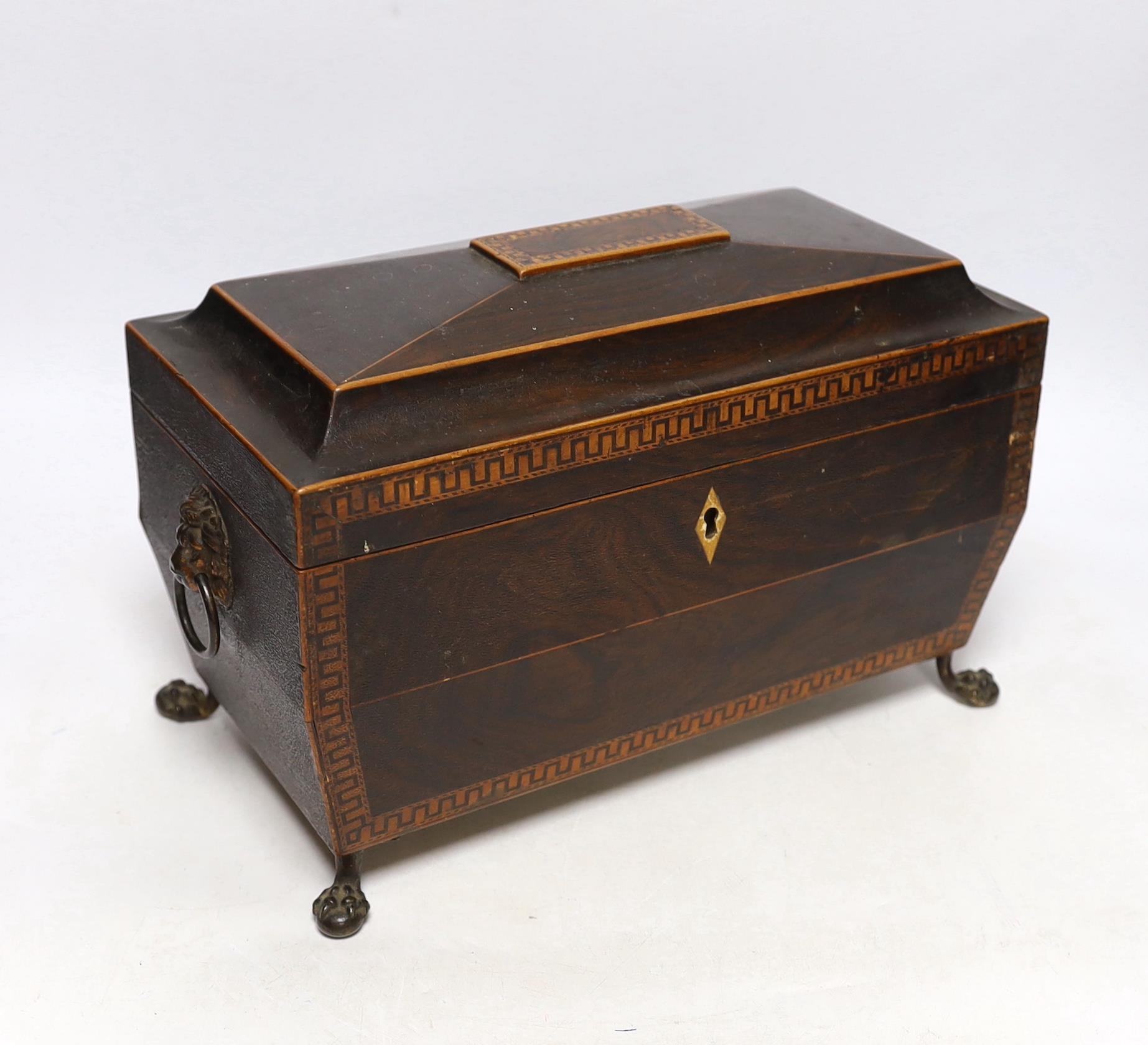 A Regency inlaid rosewood tea caddy, with two canisters, gilt brass ...