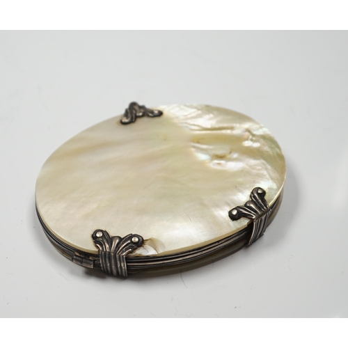 2858 - A 19th century white metal and mother of pearl mounted oval folding magnifying glass (a.f.), 90mm.... 