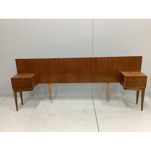 1011 - McIntosh of Kirkaldy, a mid century teak kneehole dressing table, width 141cm, depth 46cm, height 11... 