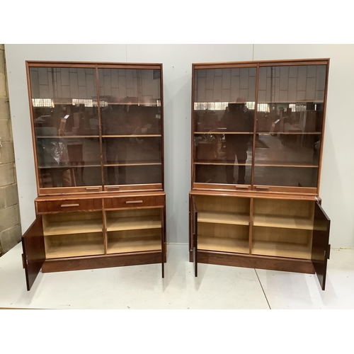 1047 - A pair of mid century Indian rosewood glazed cabinets with adjustable shelves, width 110cm, depth 38... 