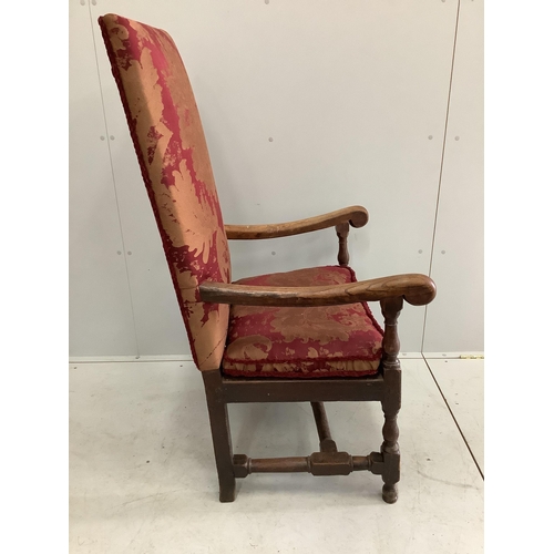 1051 - An 18th century style upholstered oak armchair, width 68cm, depth 51cm, height 125cm