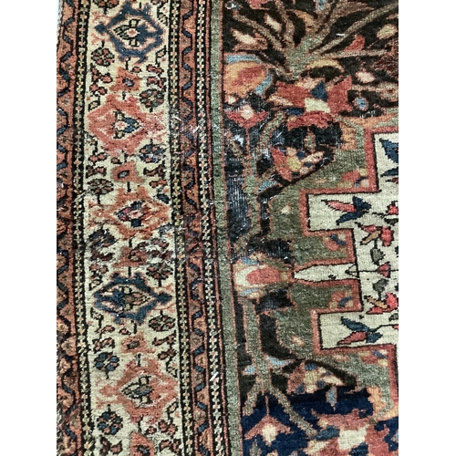 1074 - Two Tabriz blue ground rugs, larger 190 x 124cm