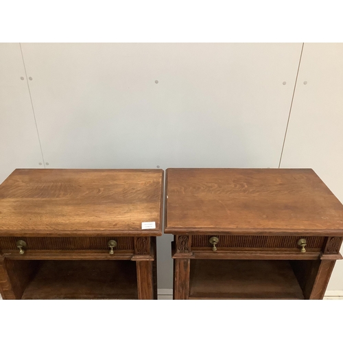 1091 - A pair of early 20th century oak open bookcases, width 58cm, depth 38cm, height 107cm