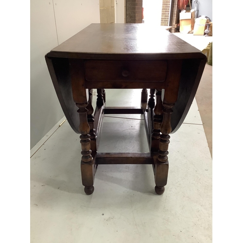 1112 - An 18th century style oak gateleg dining table, 170cm extended, depth 122cm, height 75cm together wi... 