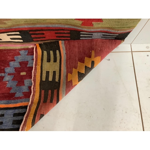 1128 - A Kilim flatweave carpet, approx. 280 x 280cm