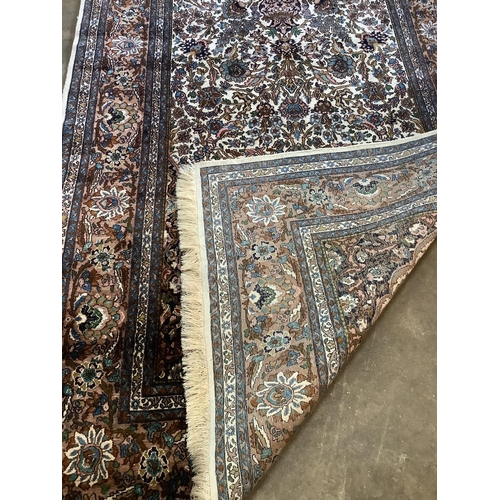 1134 - A North West Persian ivory ground rug, 220 x 136cm