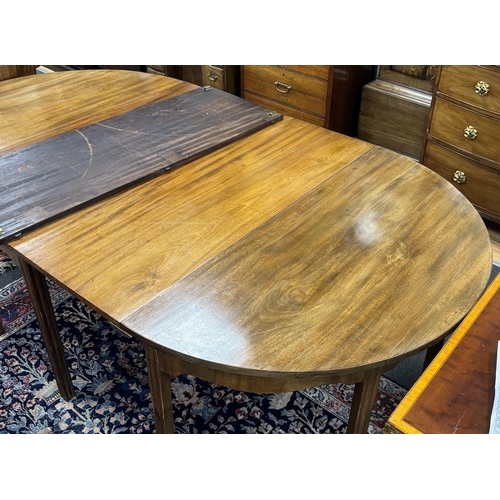 1195 - A George III mahogany D end extending dining table, 264cm extended, three spare leaves, width 121cm,... 