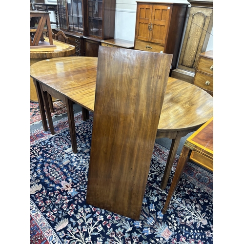 1195 - A George III mahogany D end extending dining table, 264cm extended, three spare leaves, width 121cm,... 