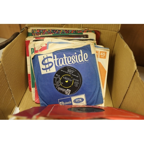 1255 - A collection of 45rpm 7 inch singles, artist include Elvis Presley, the Beatles, Creedence Clearwate... 