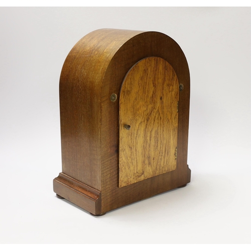 1400 - A mahogany Bulle-clock electric mantel timepiece, 30cm