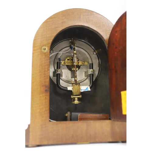 1400 - A mahogany Bulle-clock electric mantel timepiece, 30cm